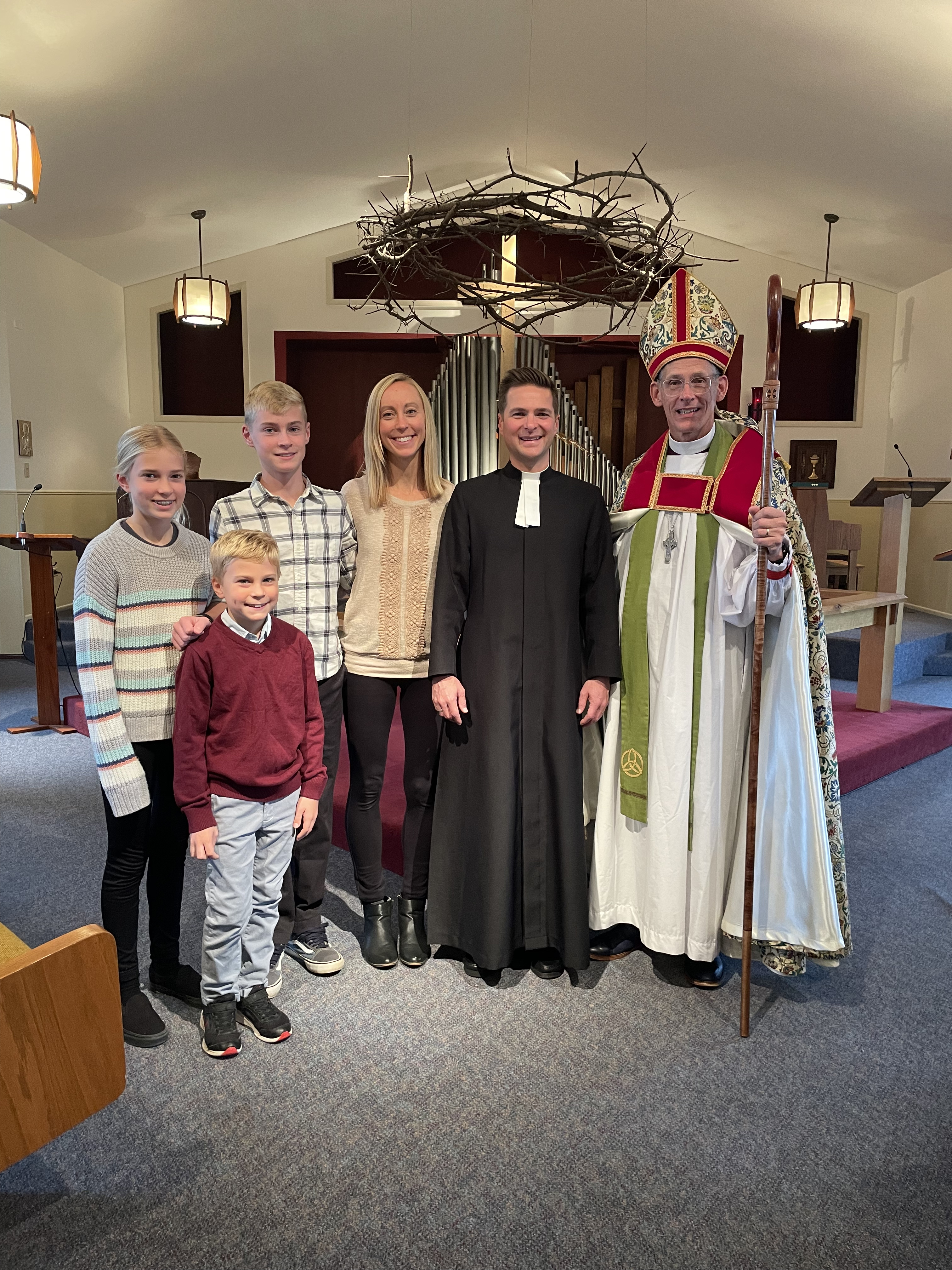 The Rev. Dr. James Arcadi with his family and Bishop Alex